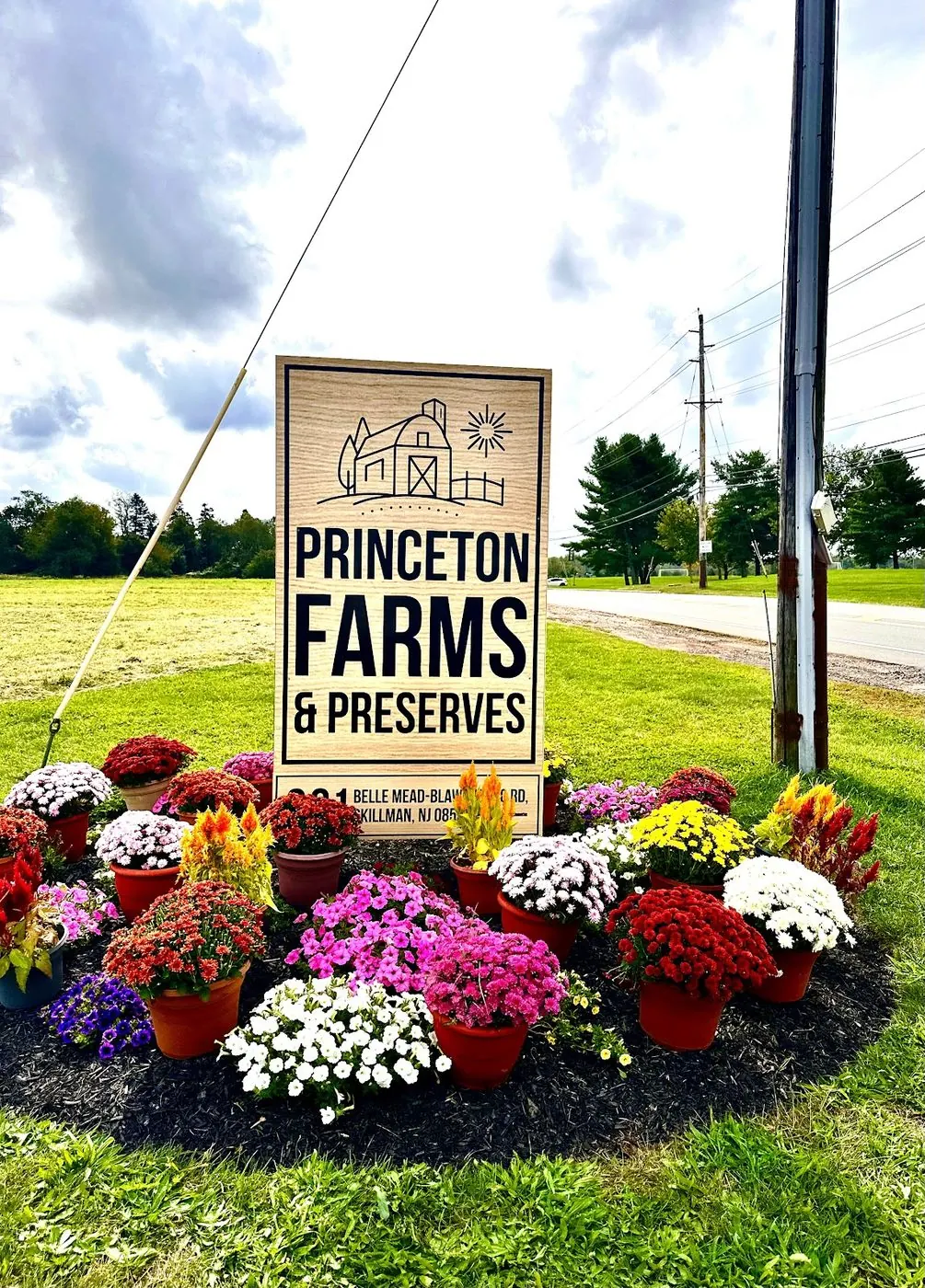 Princeton Farms & Preserves sign with fall mums